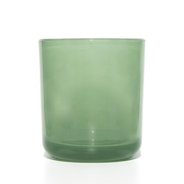 This image shows a cylindrical translucent glass candle container in a jade green color.