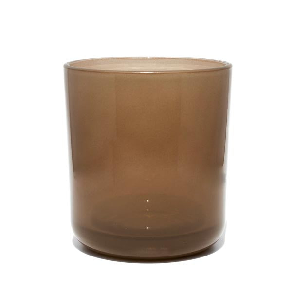 This image shows a cylindrical translucent glass candle container in a mushroom brown color.