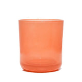 This image shows a cylindrical translucent glass candle container in a peach color.