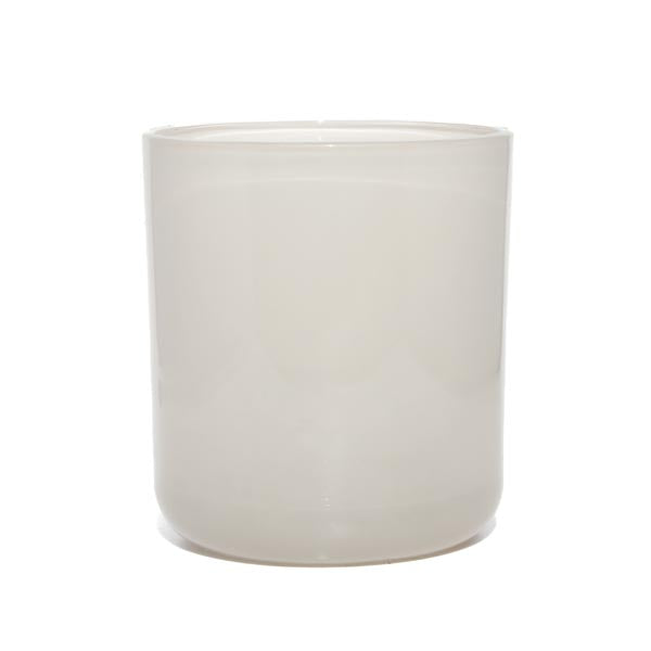 This image shows a cylindrical opaque  glass candle container in a pearl color