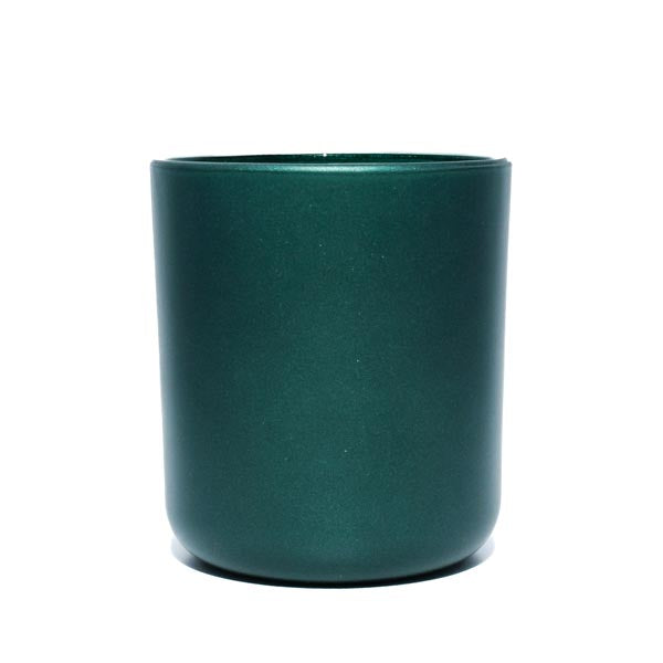 This image shows a cylindrical opaque  glass candle container in a metallic dark green color.